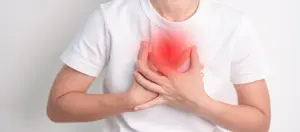 A woman is experiencing chest pain due to respiratory and cardiovascular system failure, including lung cancer and asthma, which are symptoms of emphysema.